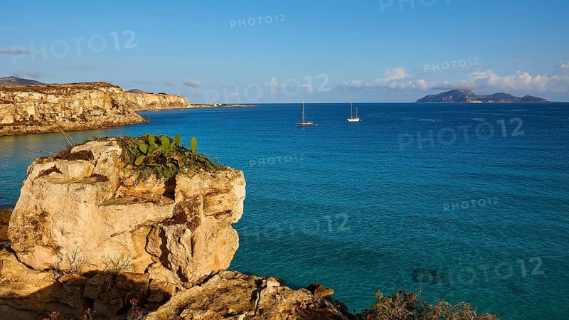 Rock, sailing boats, Levanzo Island, Scogliera di Cala Rossa, Cala Rossa, Favignana, Egadi Islands, Sicily, Italy, Europe