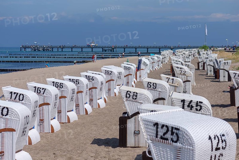 White beach chairs with pier on the beach of Heiligendamm, Mecklenburg-Western Pomerania, Germany, Europe