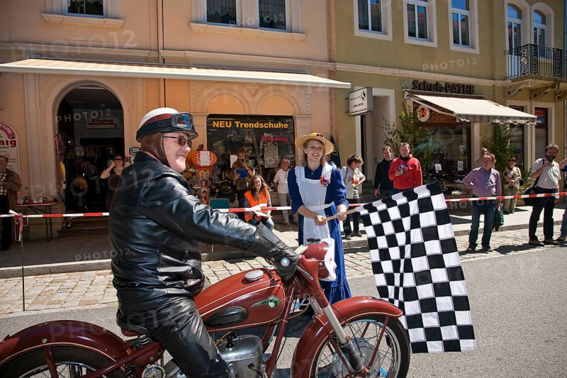 Sebnitz, town festival with classic car rally. The new flower girl Tina Häntzschel starts the motorbikes for the races