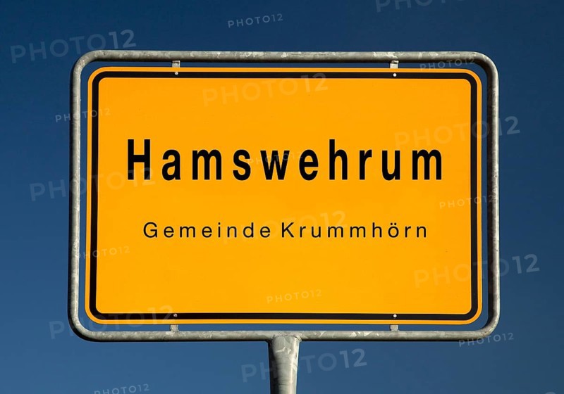 Place name sign for Hamswehrum, a village in the municipality of Krummhörn in the district of Aurich in East Frisia, Lower Saxony, Germany, Europe