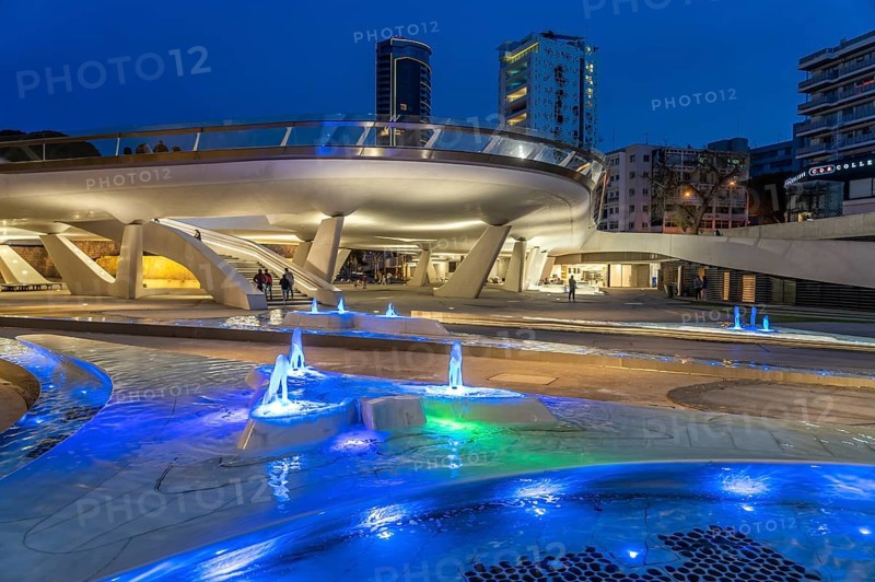 Modern architecture and colourfully lit fountains of Eleftheria Square at dusk, Nicosia, Cyprus, Europe