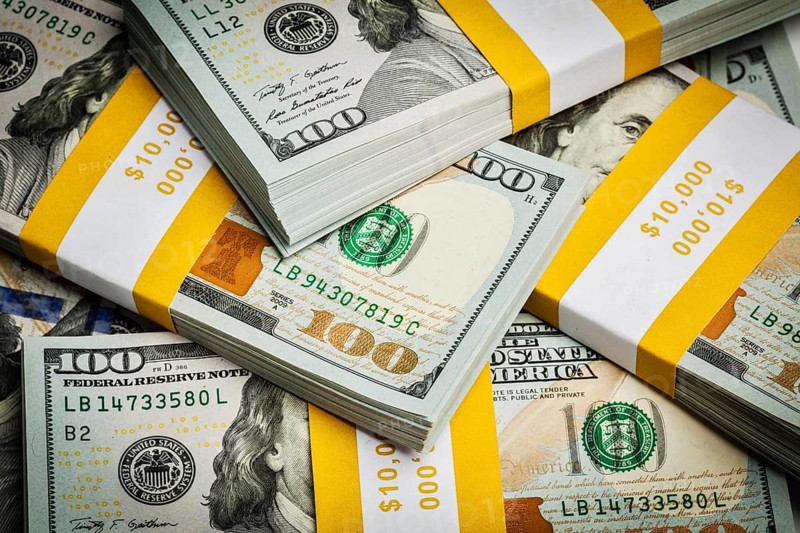 Creative business finance making money concept, background of new 100 US dollars 2013 edition banknotes bills bundles close up