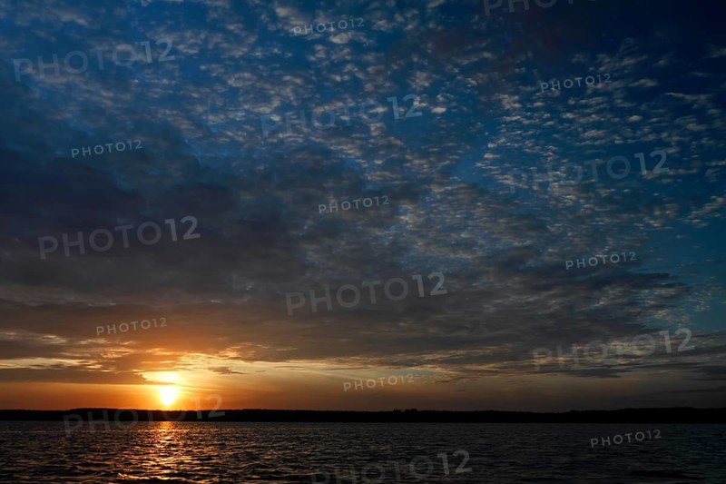 Sunrise with cloud formation over a lake in Mecklenburg, Müritz National Park, Mecklenburg-Vorpommern, Germany, Europe