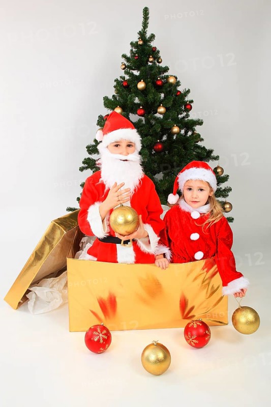 Children dressed up as Santa Claus, in big gift, on the Christmas tree, decorated Christmas tree, Santa Claus, Santa Claus costume, Santa Claus, Santa Claus box, Christmas ball, Christmas balls