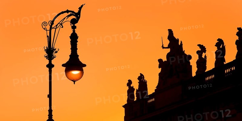 Old Berlin gas lantern in the street Unter den Linden at sunset at the German Historical Museum, Berlin, Germany, Europe