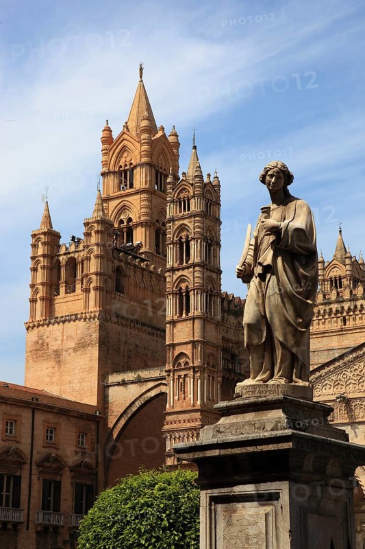 City of Palermo, the west tower at the Archbishop's Palace connected by pointed arches to the Cathedral Maria Santissima Assunta, in front of it a statue of a saint, UNESCO World Heritage Site, Sicily, Italy, Europe