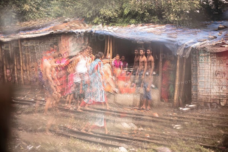 Family in front of their dwelling in the reflection of a broken mirror, Tejgaon Slum Area, Dhaka, Bangladesh, Asia