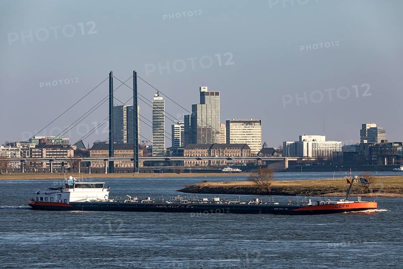 Düsseldorf, city centre skyline, skyscrapers, Rheinkniebrücke, Rhine, cargo ship