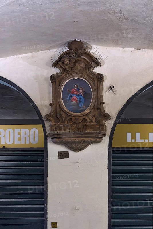 Marian picture with decorative frame in the old arcades at the harbour, Genoa, Italy, Europe