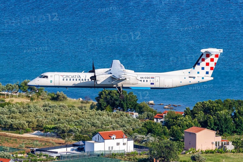 A De Havilland Canada Dash 8 Q400 aircraft of Croatia Airlines with the registration 9A-CQC at Split Airport, Croatia, Europe