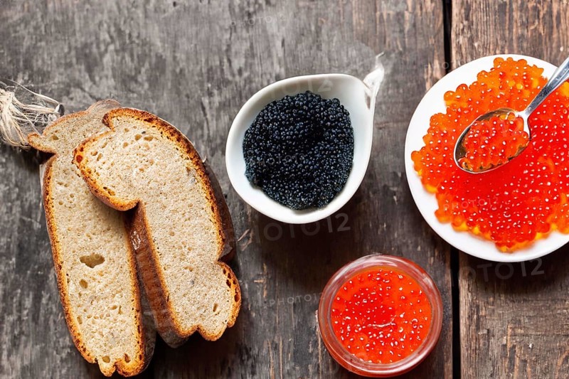 Different kinds of caviar with bread and beverages, AI generated