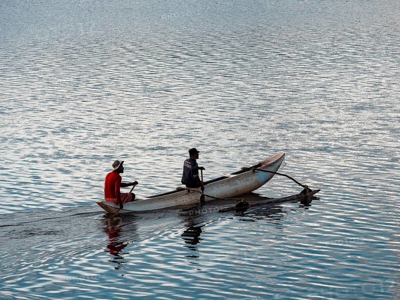 Small boat with two men, Kandalama Lake, Dambulla, Sri Lanka, Asia