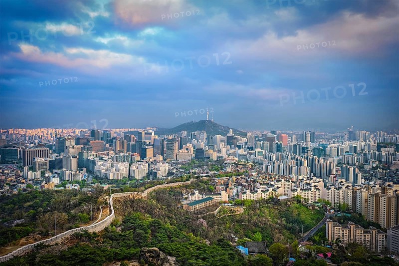 Aerial view of Seoul downtown cityscape and Namsan Seoul Tower on sunset from Inwang mountain. Seoul, South Korea, Asia