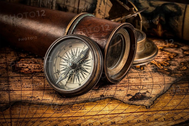 Travel geography navigation concept background, old vintage retro compass with sundial, spyglass and rope on ancient world map