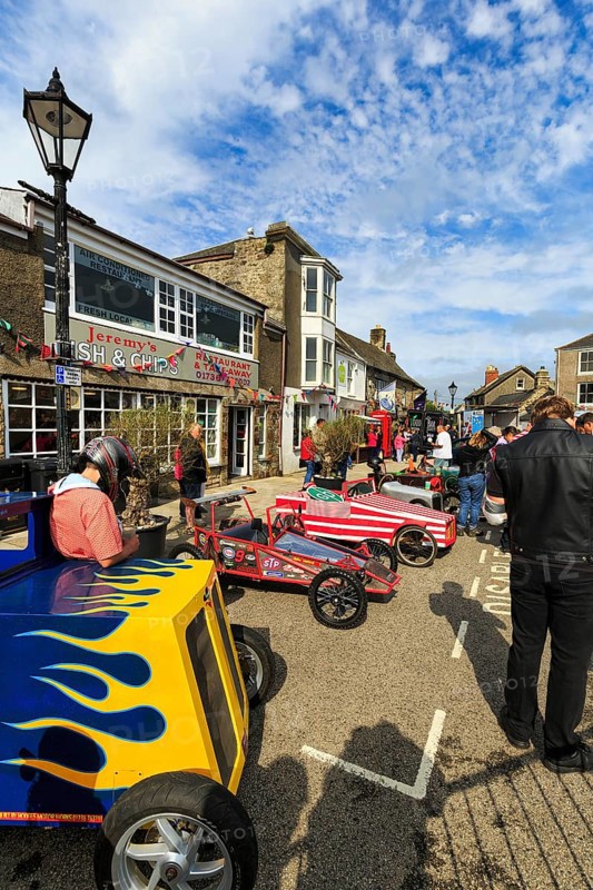 Traditional colourful soapboxes, crowd in town centre, Lafrowda Festival, St Just in Penwith, Cornwall, England, United Kingdom, Europe