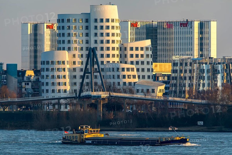 Düsseldorf, the Gehry buildings, Neuer Zollhof, in the media harbour, behind the RWI4 building complex, Rhine, cargo ship