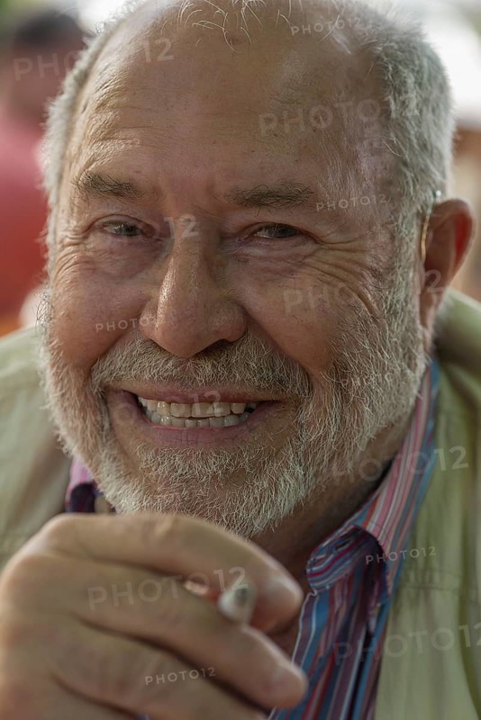 Portrait of a laughing gentleman with beard and cigarette, Bavaria, Germany, Europe