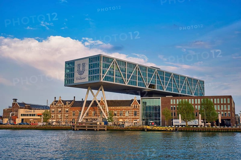 ROTTERDAM, NETHERLANDS, MAY 11, 2017: Unilever Bestfoods headquarters building De Brug (The Bridge) built over an existing historical factory from 1891 designed by architect Chris de Jonge