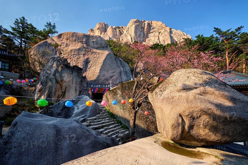 SEORAKSAN, SOUTH KOREA, APRIL 15, 2017: Kyejoam Seokgul Hermitage shrine and Ulsanbawi rock in Seoroksan National park, South Korea, Asia