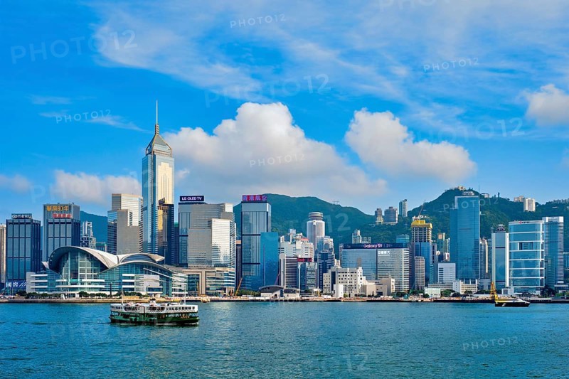 HONG KONG, CHINA, MAY 1, 2018: Hong Kong skyline cityscape downtown skyscrapers over Victoria Harbour on sunset. Hong Kong, China, Asia