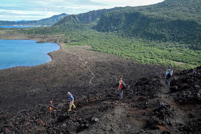 Hikers at the still active volcano Mount Tavurvur, Rabaul, East New Britain, Bismarck Archipelago, Papua New Guinea, Oceania