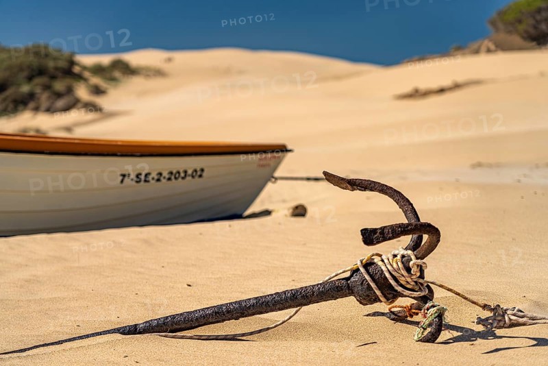 Rusty anchor on the beach of Bolonia, Tarifa, Costa de la Luz, Andalucia, Spain, Europe