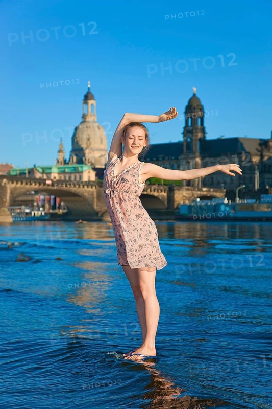Young woman on the Elbe meadows in Dresden