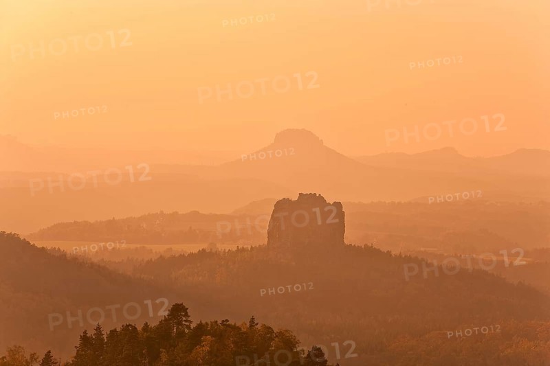View from the Carola rock into the Schrammstein area in the back of Saxon Switzerland, to the Falkenstein and the Lilienstein