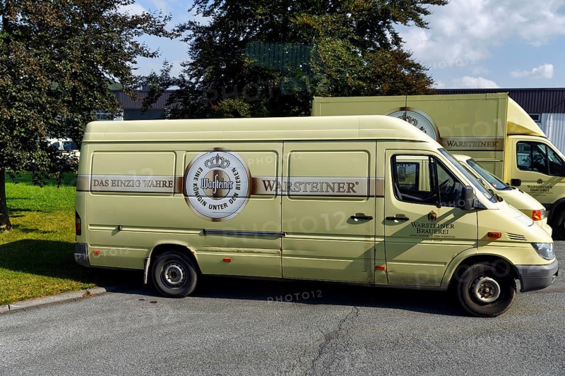 Old van with logo and slogan on car park, visitor centre of the Warsteiner brewery, Warstein, Sauerland, North Rhine-Westphalia, Germany, Europe
