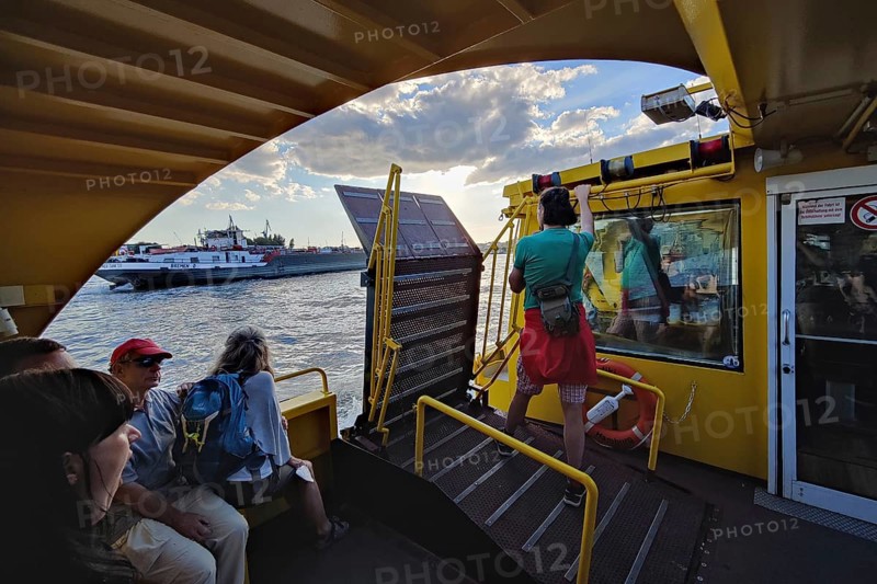 Passengers on a harbour ferry on the Norderelbe, Hamburg, Germany, Europe