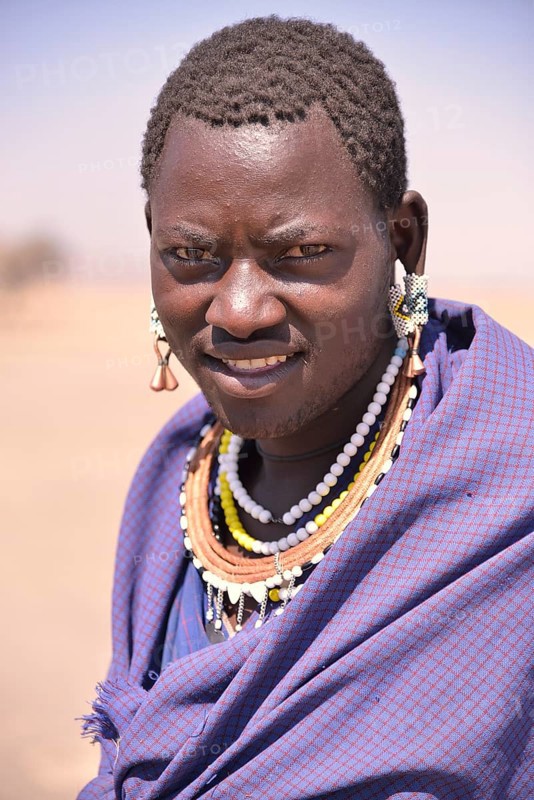 Maasai man wearing traditional dress, Ngorongoro Conservation Area, Ndema, Tanzania, Africa