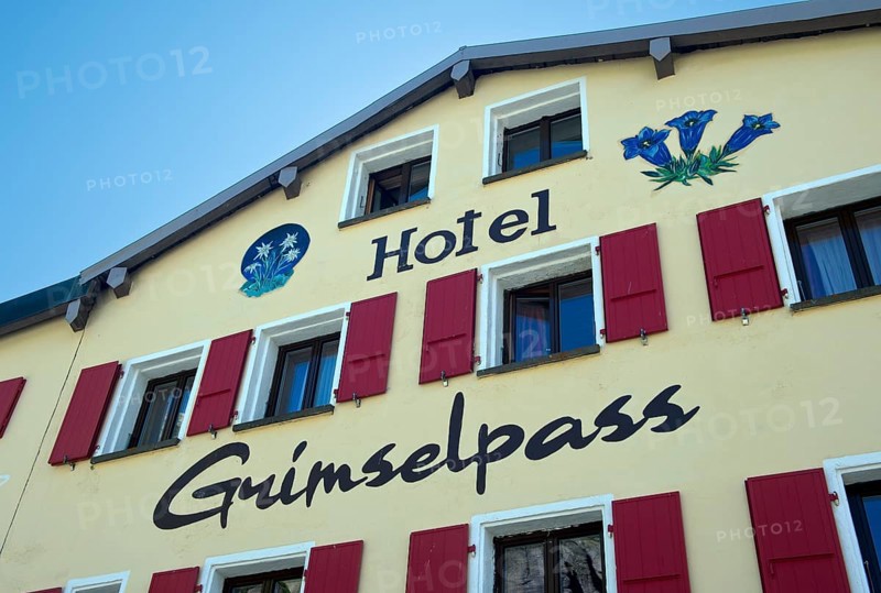 Images of edelweiss and gentian on the gable of the Berghotel Alpenlodge Grimselpass, Oberwald, Valais, Switzerland, Europe