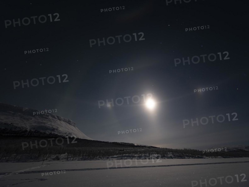 Northern Lights with Moon Halo, Moon-dogs, the Big Dipper and Polaris next to Saana, a sacred Sámi mountain