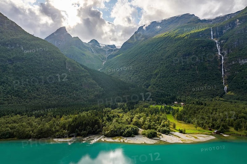 Lake Lovatnet, turquoise lake with mountain flanks and waterfalls, Loen, Stryn, Fe, Norway, Europe