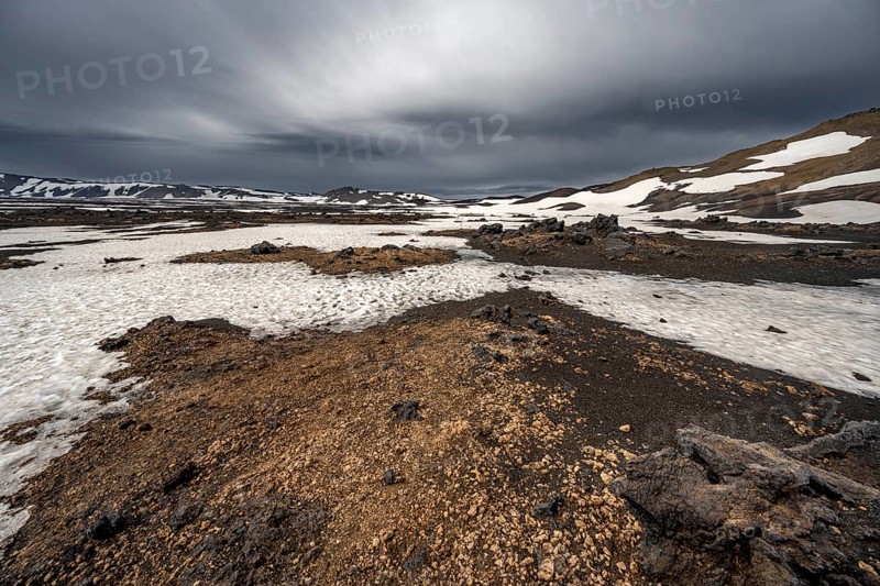 Snow-covered volcanic landscape with tuff and petrified lava, crater of Askja volcano, Icelandic highlands, Iceland, Europe