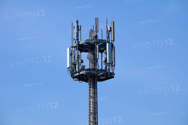 Mobile phone mast, transmission mast in front of sky, Hesse, Germany, Europe