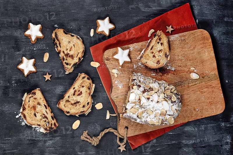 Top view of slice of German Stollen cake, a fruit bread with nuts and dried fruits served during Christmas time