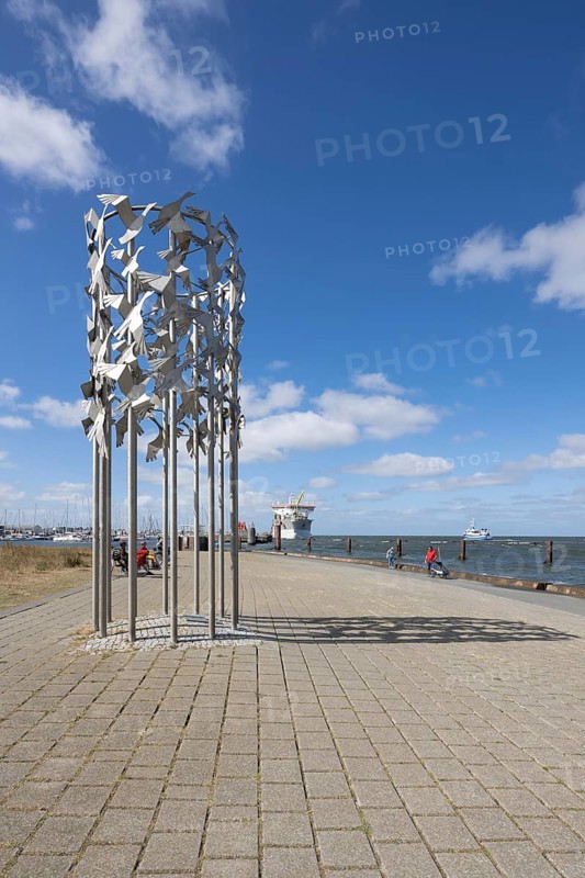 Metal sculpture bird flight connected in freedom, Cuxhafen, Lower Saxony, Germany, Europe