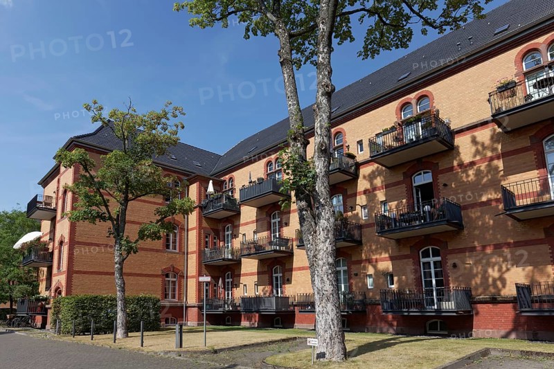 Residential complex, rental flats with balcony in renovated brick building, former Reuter barracks, Düsseldorf, North Rhine-Westphalia, Germany, Europe