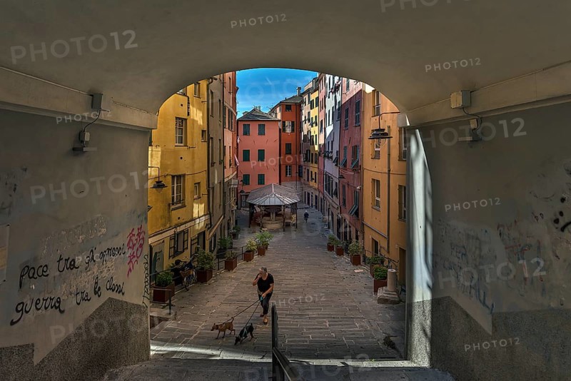 Colourful houses in Piazza Truogoli di Santa Brigada, below one of the few remaining public wash houses built in 1656, Genova, Italy, Europe