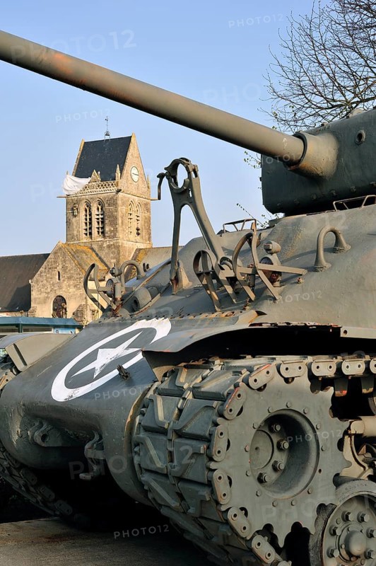 M4 Sherman tank in the Airborne Museum and parachute memorial in honour of paratrooper John Steele, who was trapped on the steeple during D-Day, Sainte-Mere-Église, Normandy, France, Europe