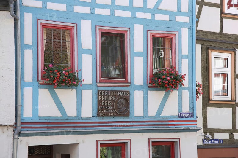 Window of the house where Philipp Reis was born with inscription and half-timbering, Langgasse, Gelnhausen, Hesse, Germany, Europe