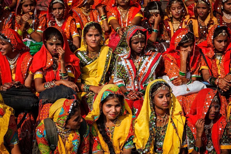 PUSHKAR, INDIA, NOVEMBER 21, 2012: Unidentified Rajasthani girls in traditional outfits prepare for dance perfomance at annual camel fair Pushkar Mela in Pushkar, Rajasthan, India, Asia