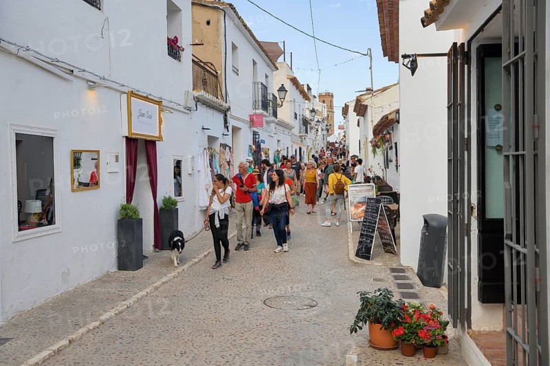 Passers-by in an old town alley, Altea, Costa Blanca, province of Alicante, Valencia country, Spain, Europe