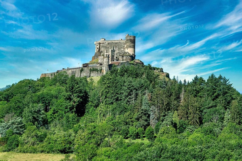 Murol castle built on a basalt promontory in the 13th century. Auvergne Volcanoes Natural Park. Puy de Dome department, Auvergne Rhone Alpes. France