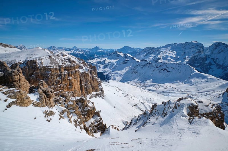 View of a ski resort piste and Dolomites mountains in Italy from Passo Pordoi pass. Arabba, Italy, Europe