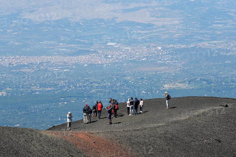 Hikers in the crater landscape of the volcano Etna, summit region, province of Catania, Sicily, Italy, Europe