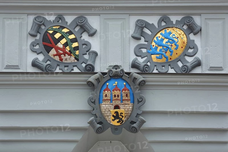 Electoral Saxon coat of arms, city coat of arms and Staufer coat of arms on the town hall, detail, volutes, Obermarkt, Freiberg, Saxony, Germany, Europe