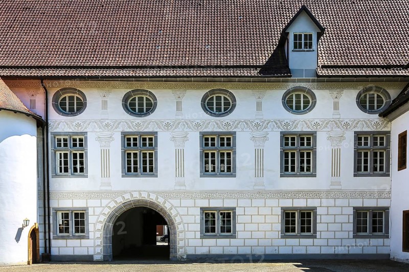 Helfenstein Castle, Wiesensteig Castle, residential castle of the Helfensteins, banqueting hall building, south wing, inner courtyard, painted façade, mural painting, historic building, Renaissance style, architecture, former residence, town house, former seat of the Counts of Helfenstein-Wiesensteig, façade, round window, ox-eye window, Wiesensteig, Filstal, Baden-Württemberg, Germany, Europe