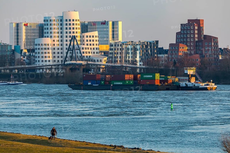 Düsseldorf, the Gehry buildings, Neuer Zollhof, in the media harbour, behind the RWI4 building complex, Rhine, cargo ship